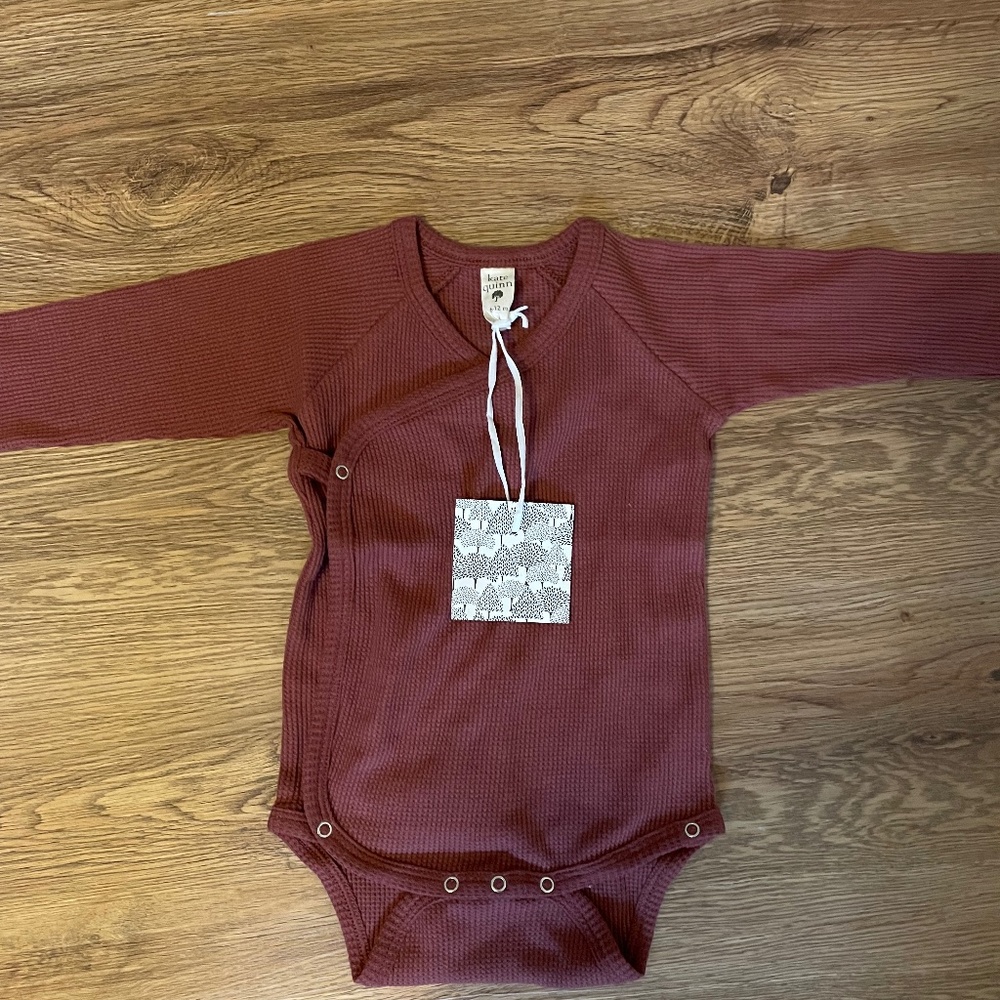 Kate Quinn onesie